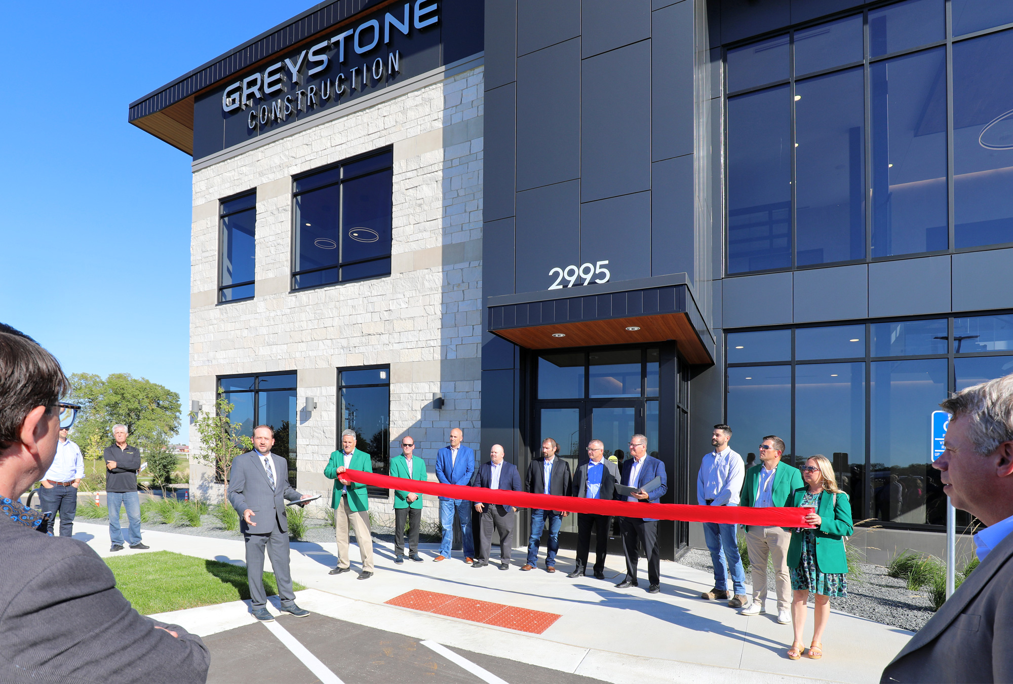 Shakopee Chamber President Tim Zunker speaks at Greystone Construction Ribbon Cutting